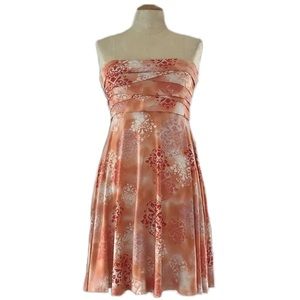 CLASSIQUE peach tie-dye jersey strapless dress w/ damask motif & pleated bodice.